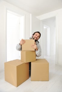 Man with boxes moving in new house